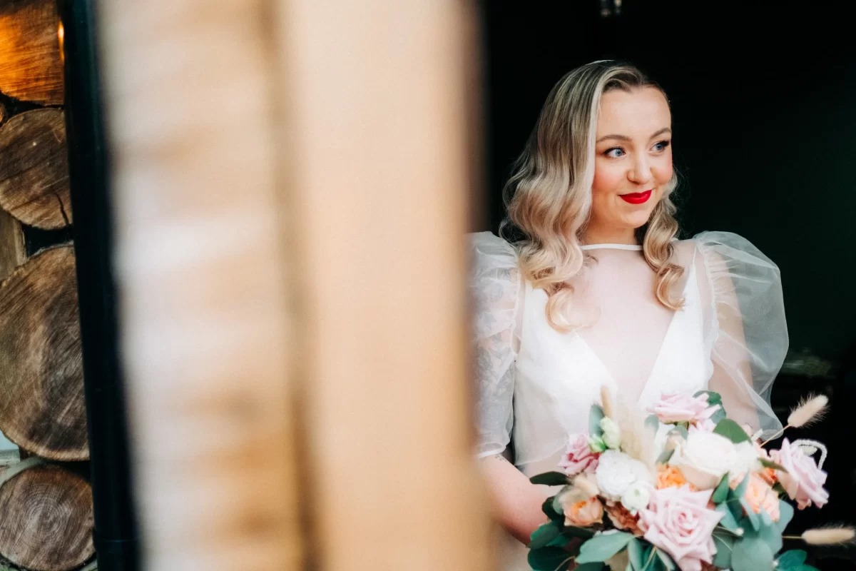the dreys woodland wedding photographer Kent — bride ready for ceremony holding flowers