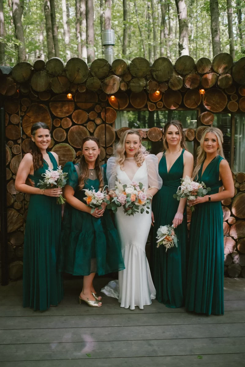 bridesmaids with bride in the woods at the dreys wedding venue in kent