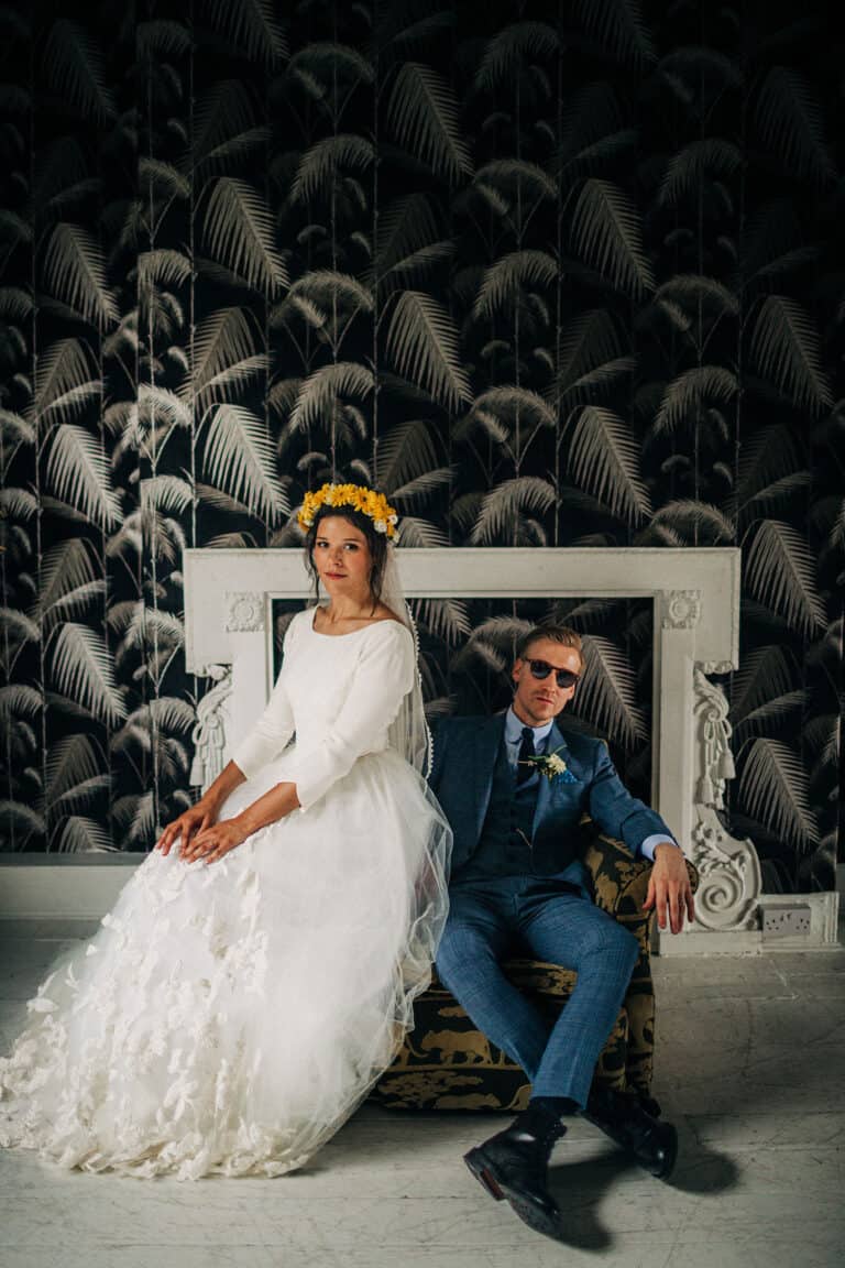 wedding couple bride and groom posing at the roost like a magazine cover