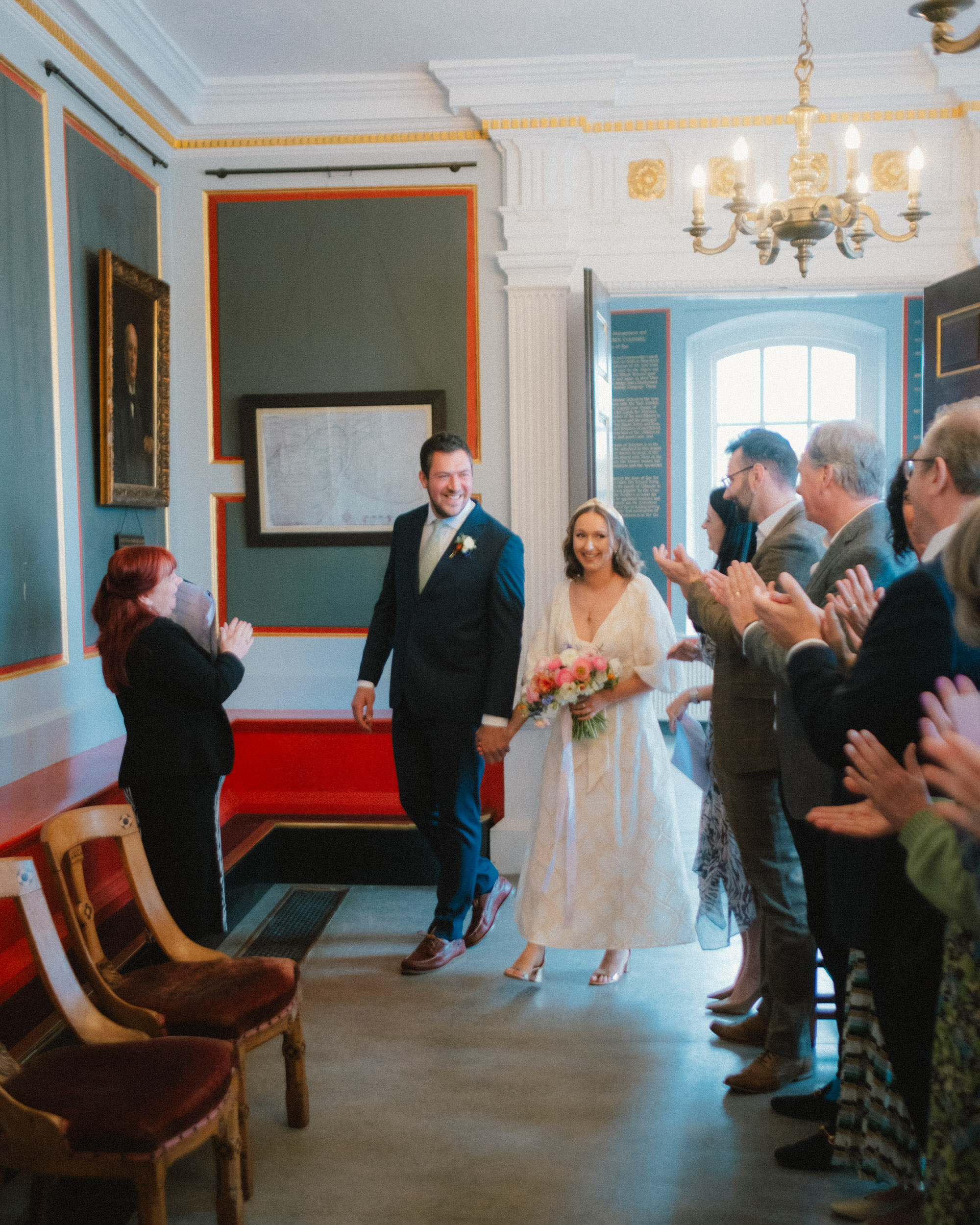 Tibbs Farm wedding - couple entering rye town hall for their wedding
