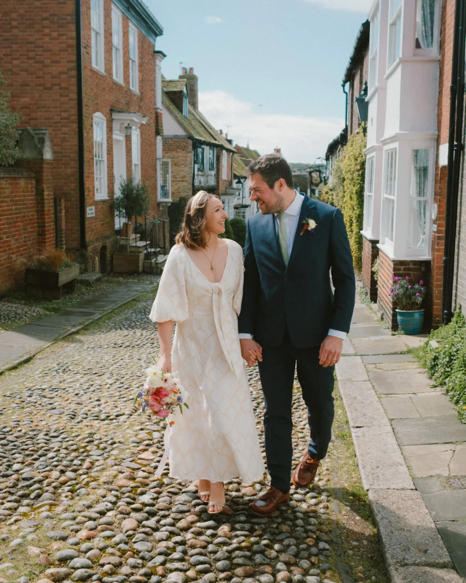 Tibbs Farm wedding- couple walking cobbled streets of rye