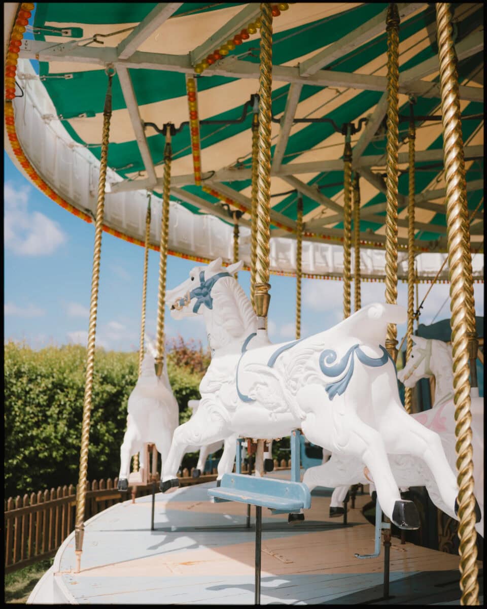 Vintage white and blue carousel horse at Preston Court wedding venue in Canterbury Kent.
