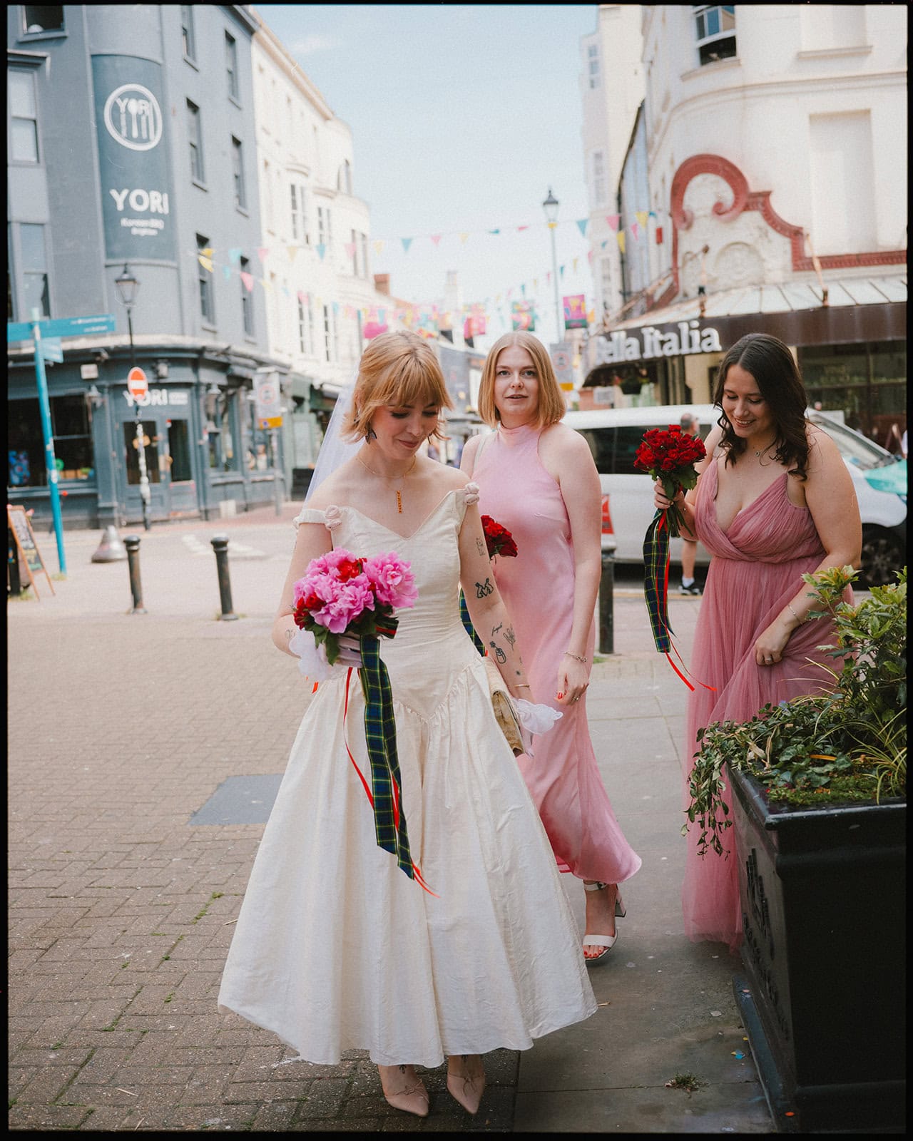 Brighton wedding photographer sussex - bride with bridesmaids walking to town hall