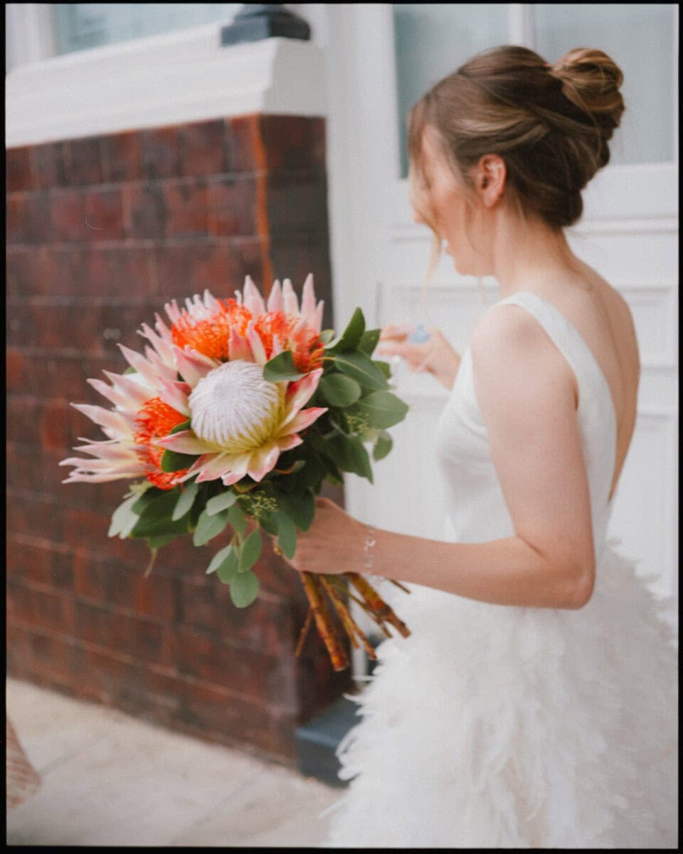 The Depot N7 wedding photographer London — bride with bouquet