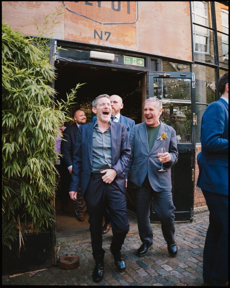 The Depot N7 wedding photographer London — uncles laughing