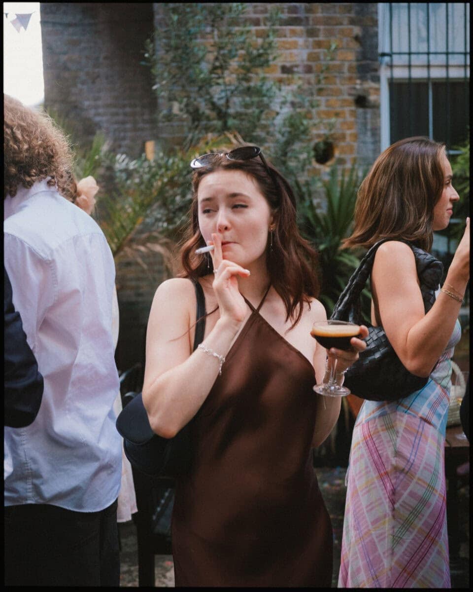 The Depot N7 wedding photographer London — guest posing with cigarette