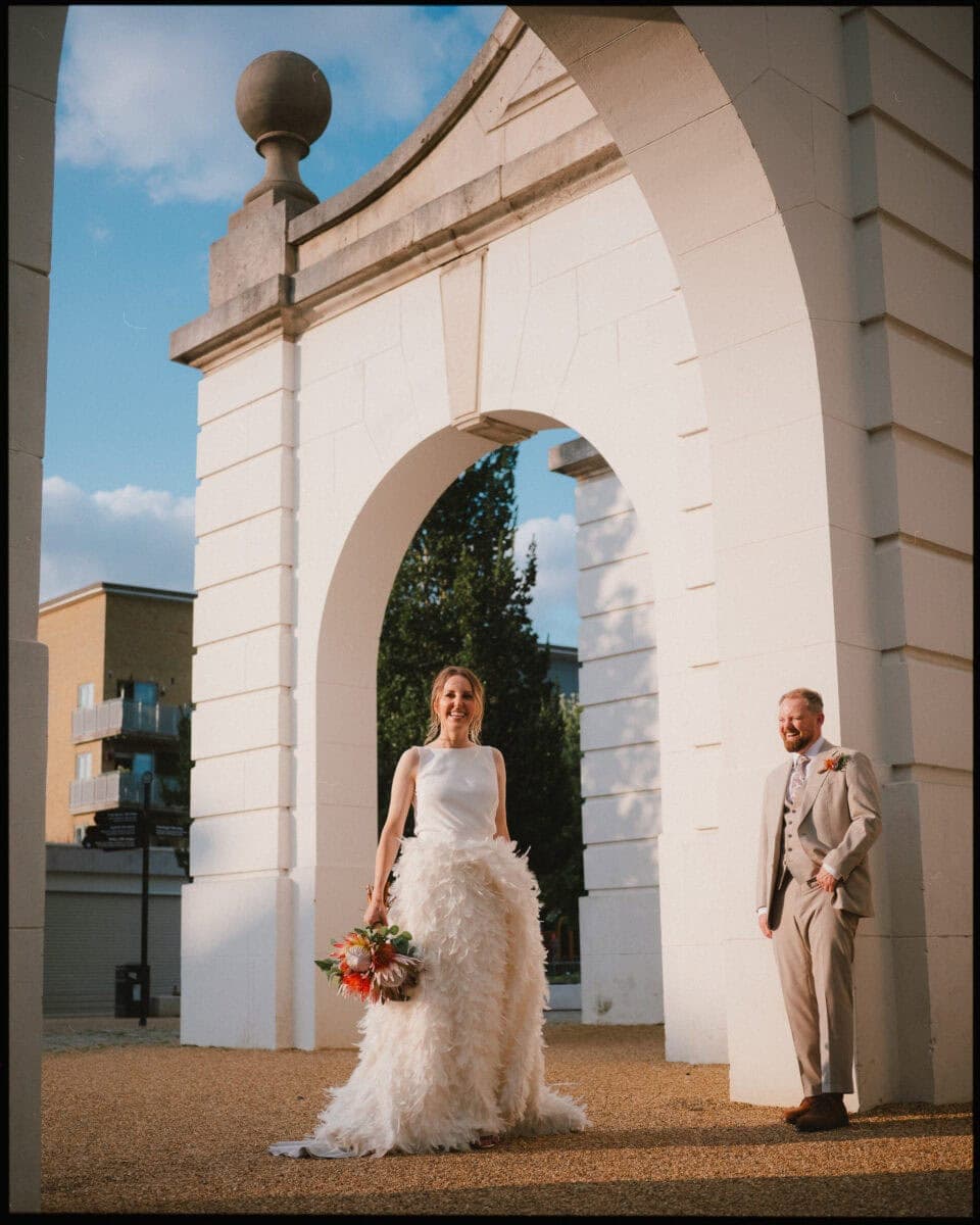 The Depot N7 wedding photographer London — couple in architecture arch in park