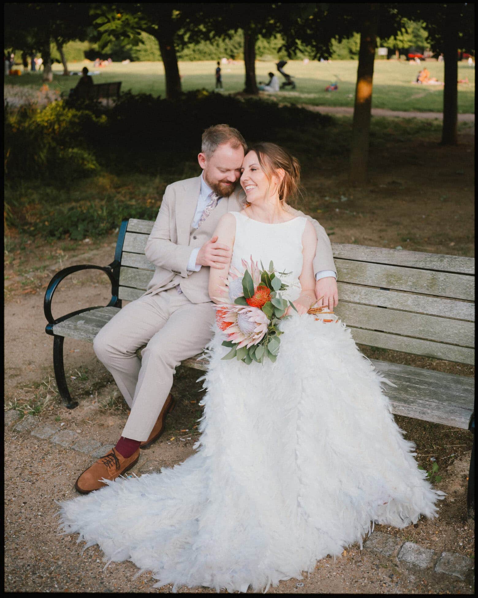 The Depot N7 wedding photographer London — couple in park on bench