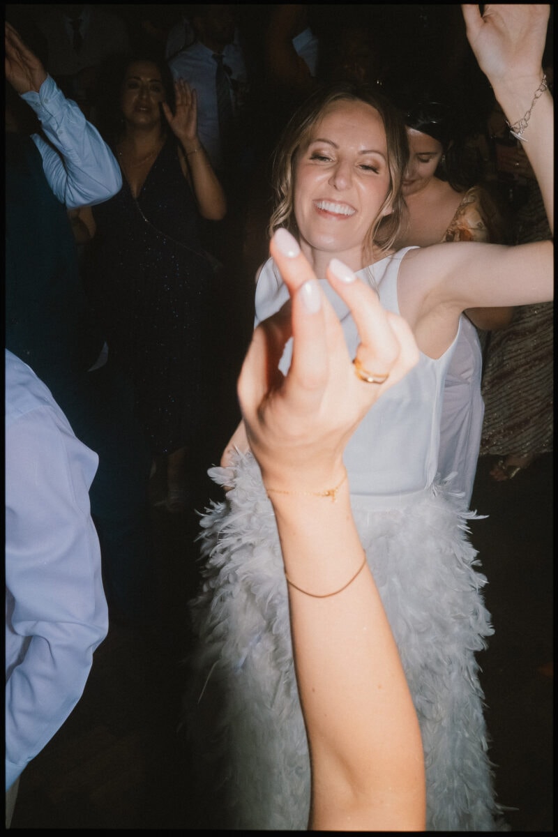 The Depot N7 wedding photographer London — pov of a guest dancing with bride