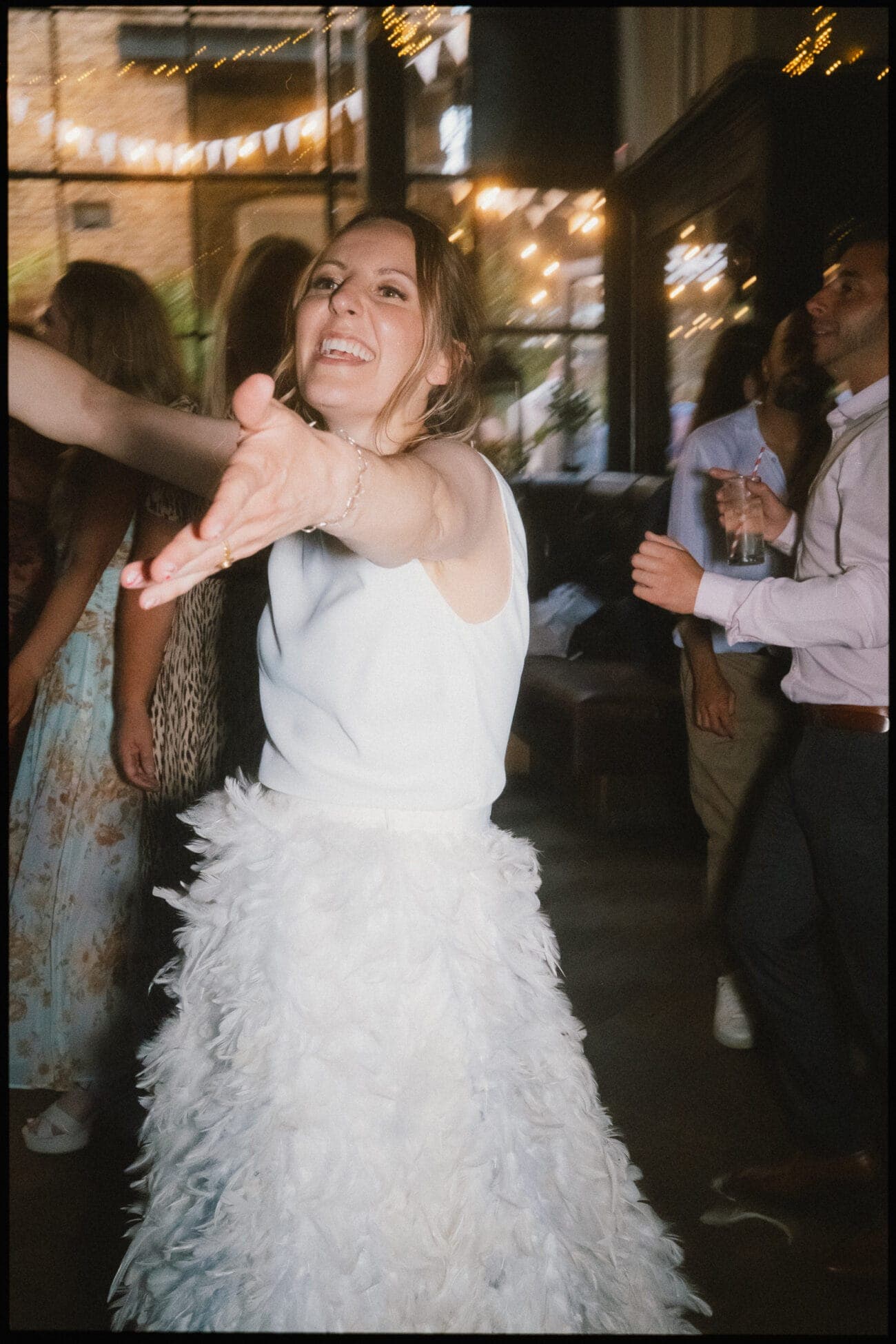 A woman in a white dress captured by an alternative wedding photographer in London.