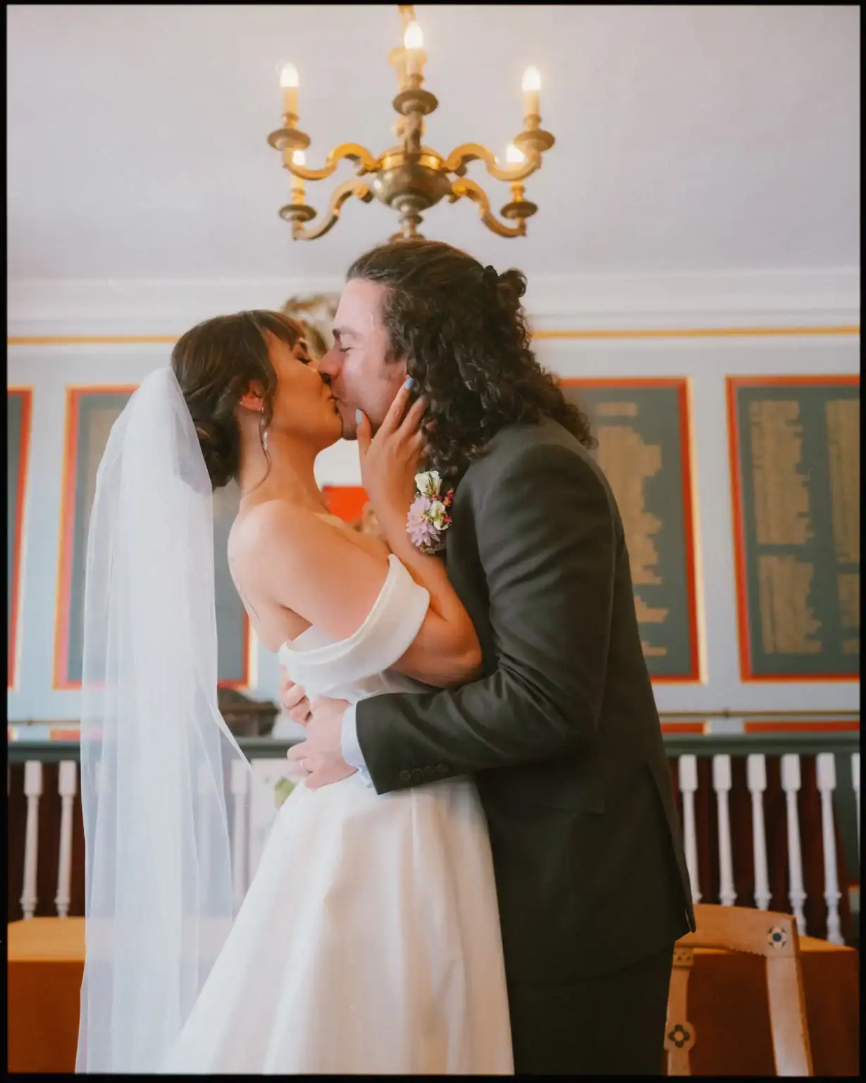 first kiss for bride and groom at the rye town hall