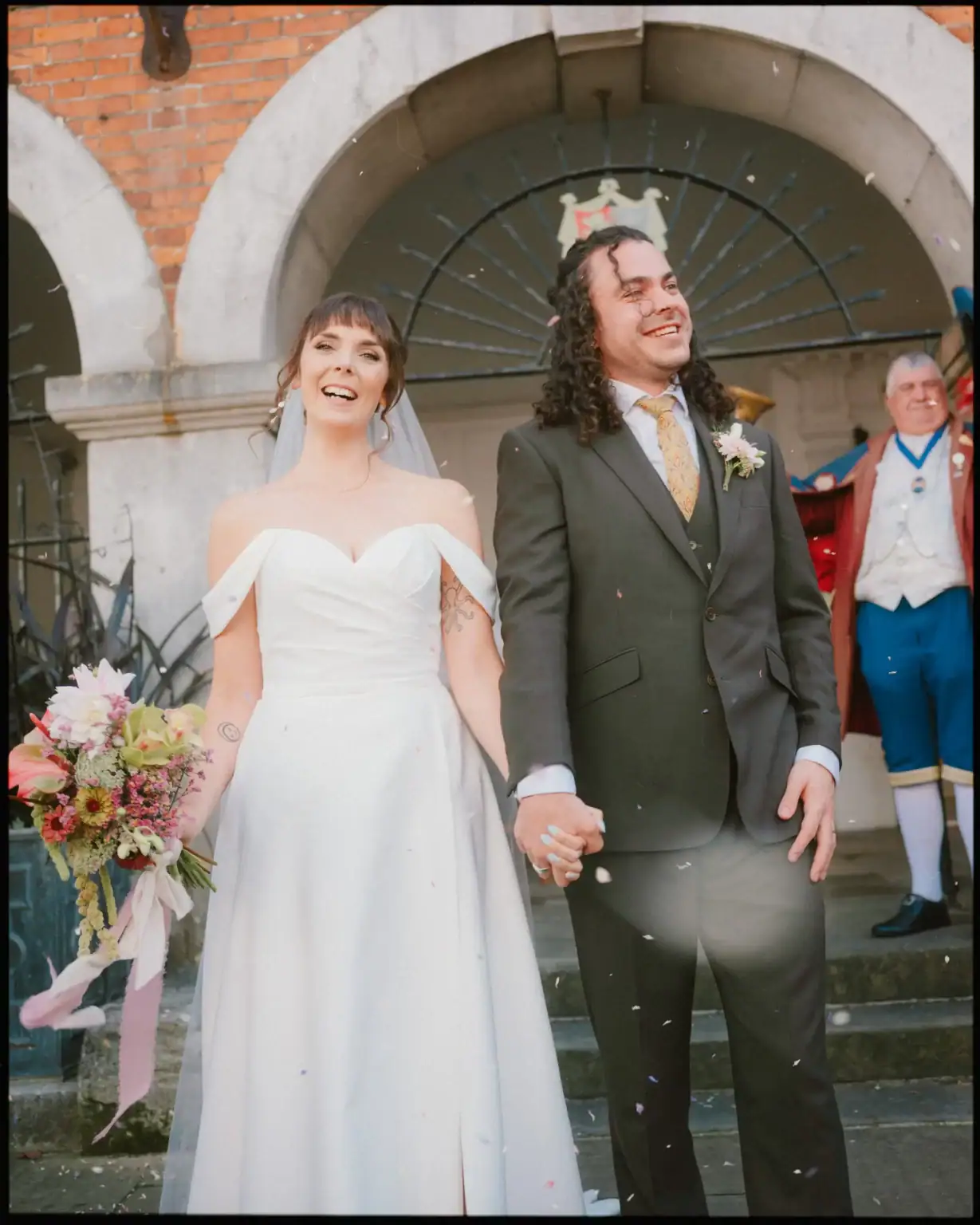 confetti shot at bride and groom outside rye town hall