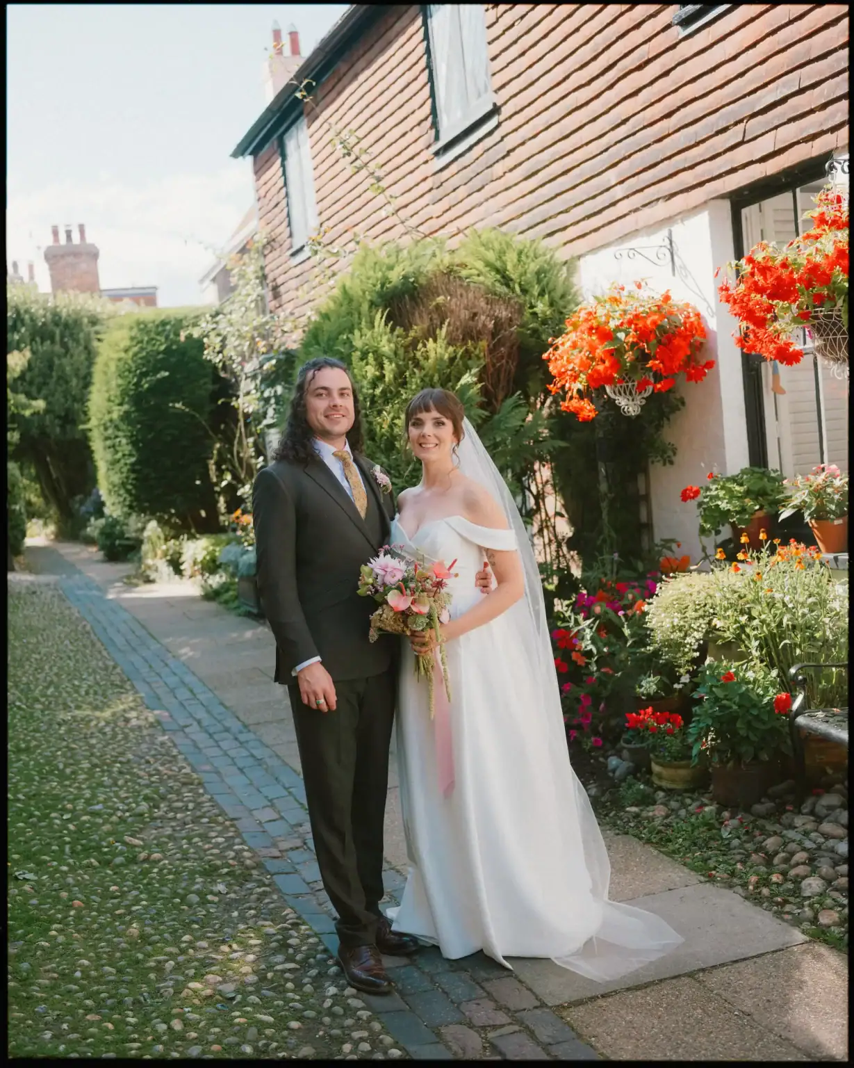 bride and groom photograph on cobbled streets of rye