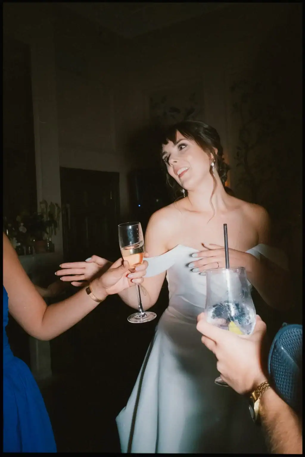 bride drinking and dancing in the ballroom at the george in rye