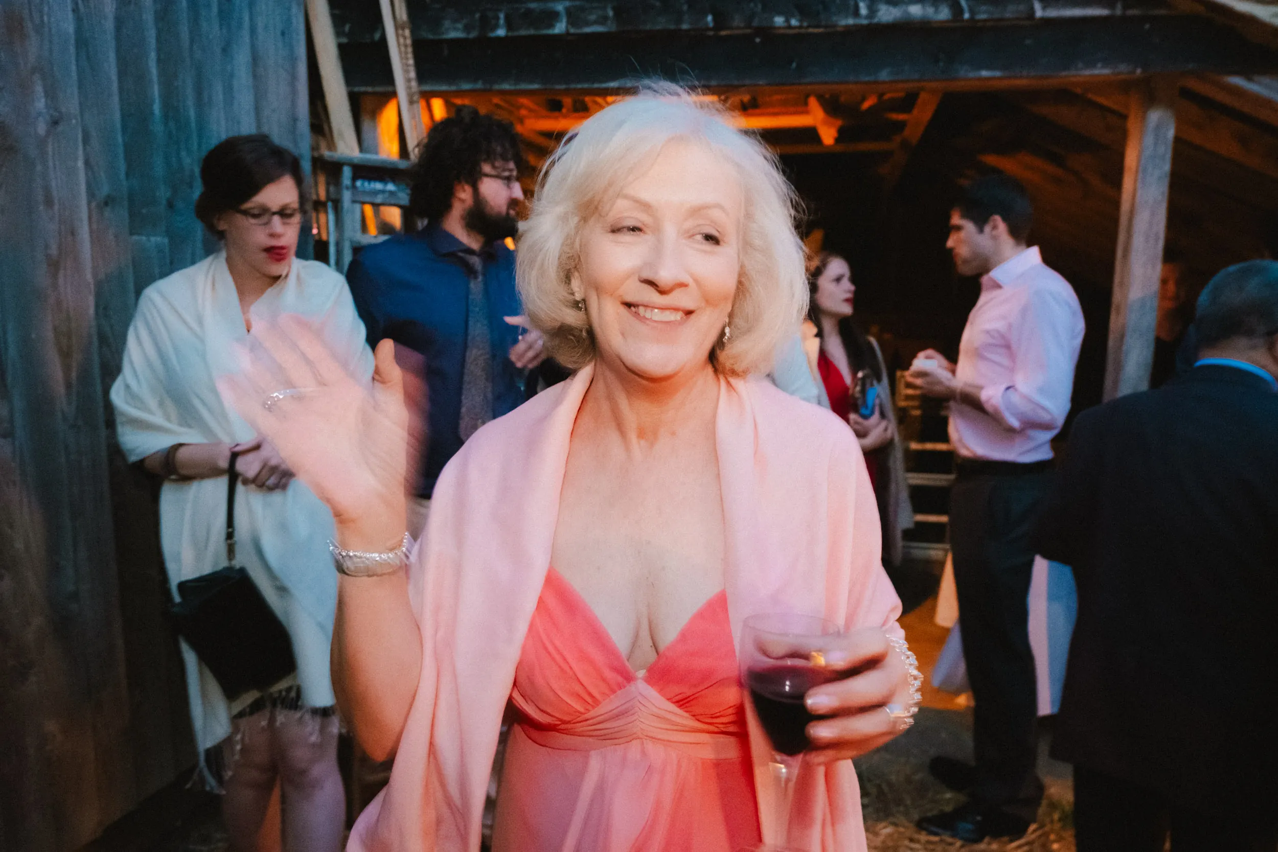 guest with drink candid documentary photo at exclusive woodland wedding venue paper mill kent