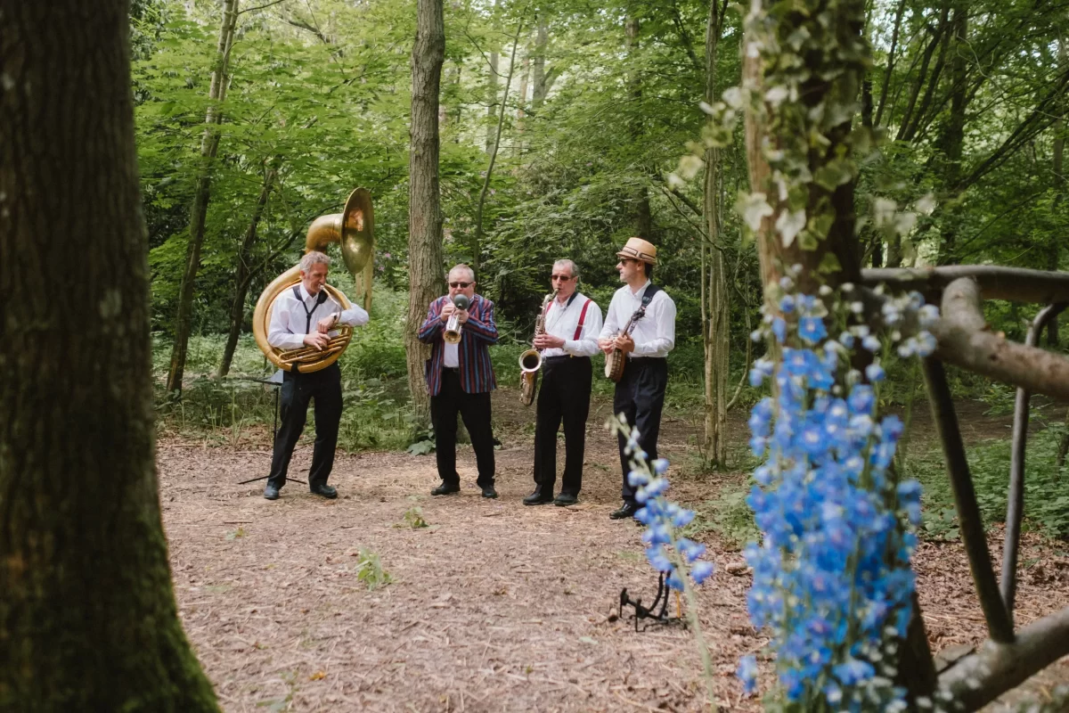 brass band in the woods during the ceremony at exclusive woodland wedding venue paper mill kent