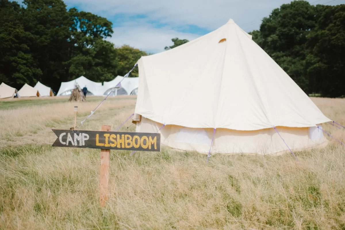 tents in field at exclusive woodland wedding venue paper mill kent