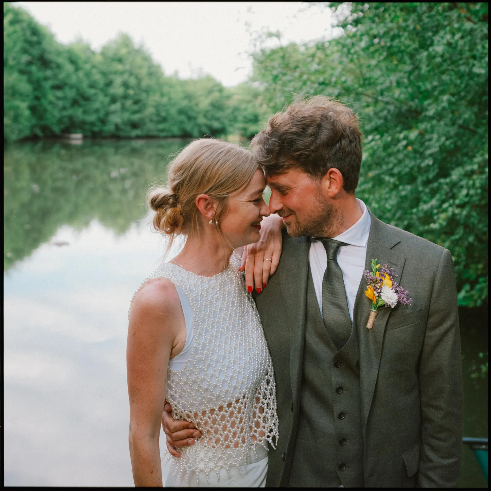Frickley Lake Wedding Photographer Ninfield - couple in front of lake
