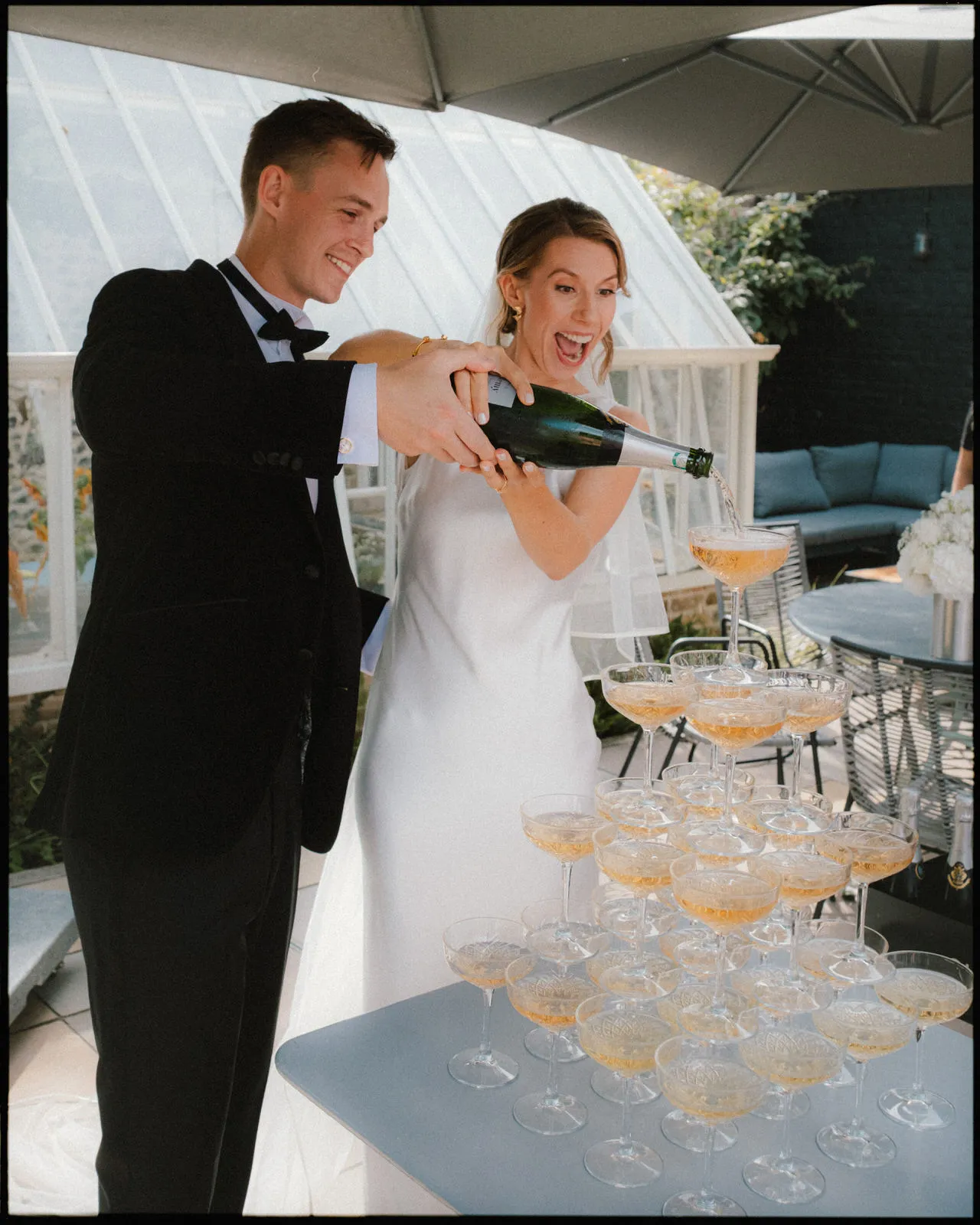 Chapel House Estate Wedding Photographer - Couple pouring champagne tower