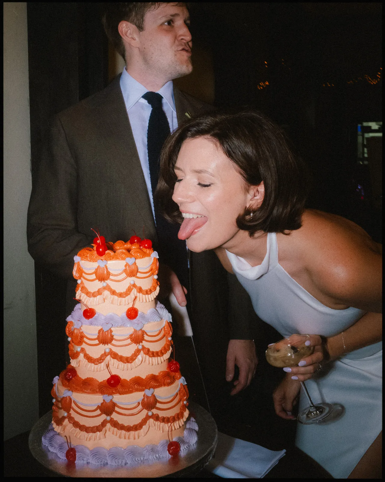 royal inn on the park wedding photographer london - bride and groom cutting vintage cake