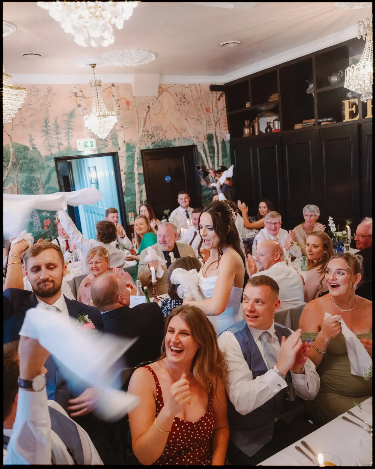 the bell in ticehurst wedding photography sussex - bride and groom entrance napkins wedding breakfast