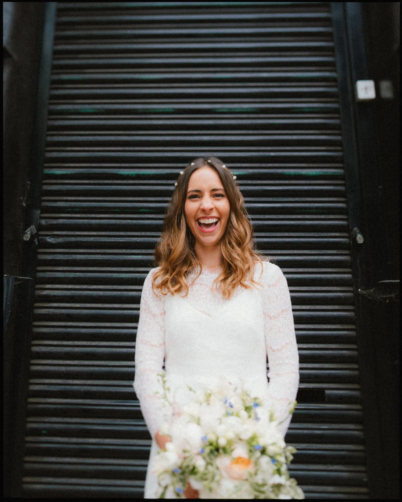 London wedding photographer - bride portrait in front of shutters