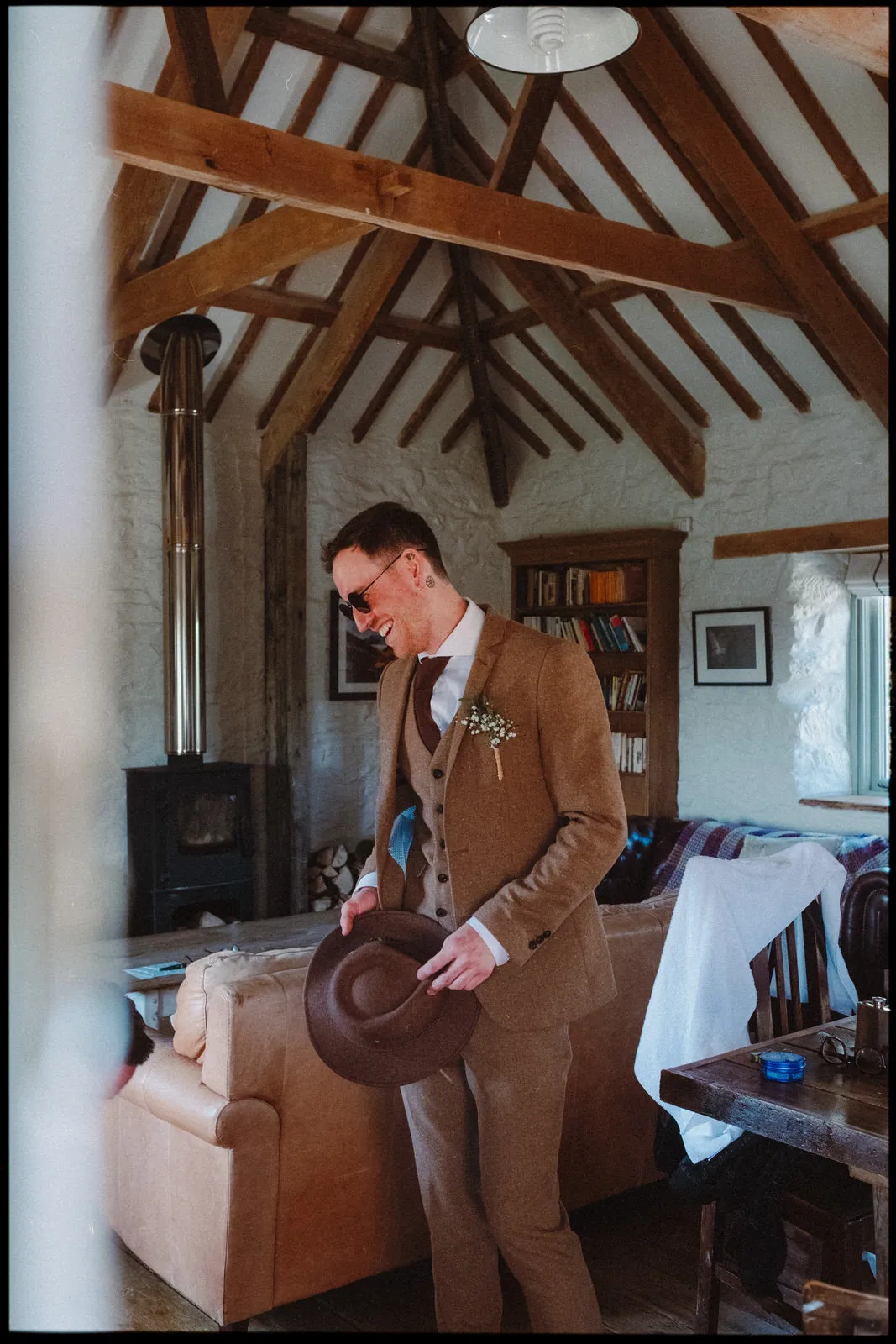nancarrow farm wedding photographer cornwall - groom getting ready in sunglasses 
