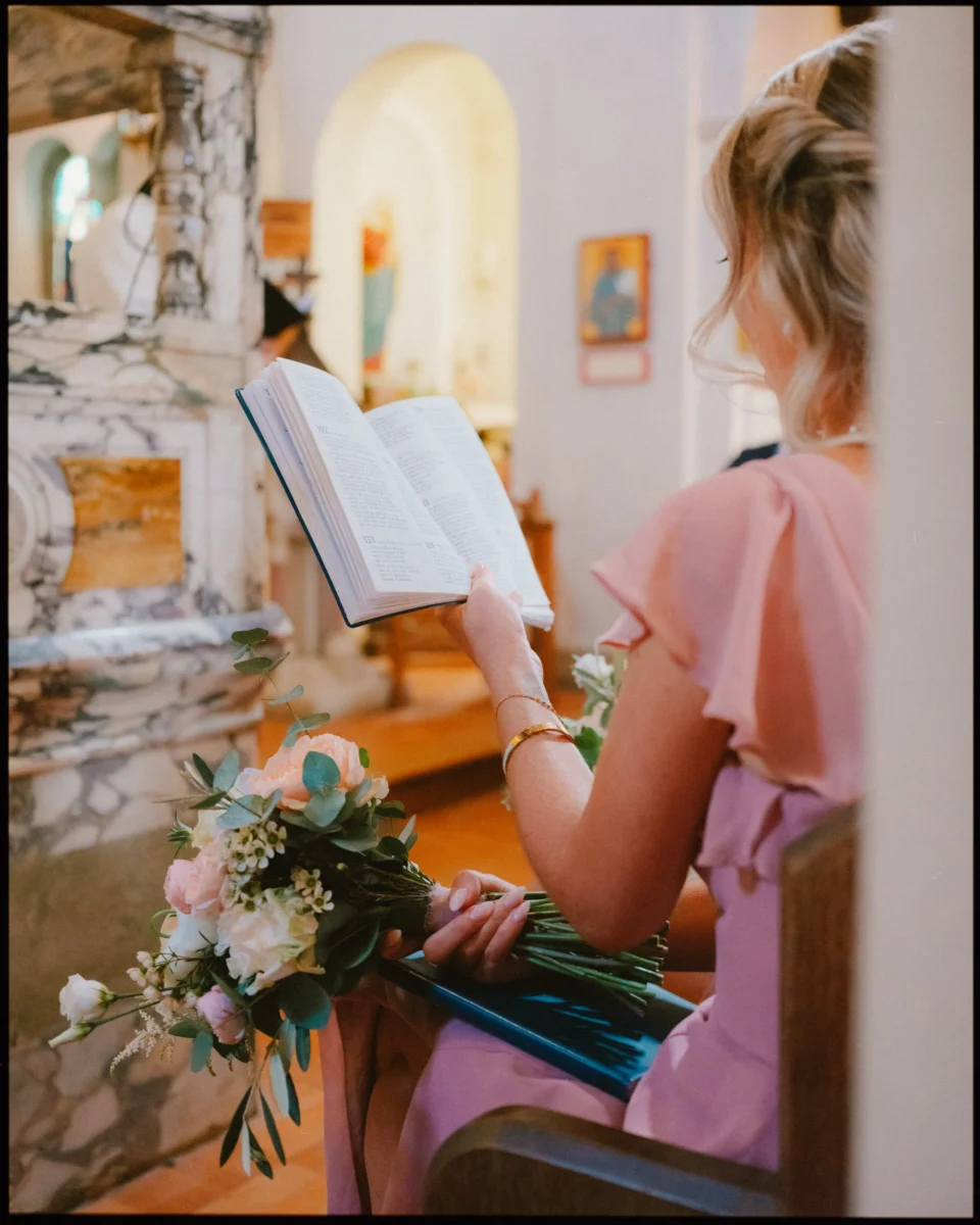 george in rye wedding photographer bridesmaid reading hymns in st anthonys church