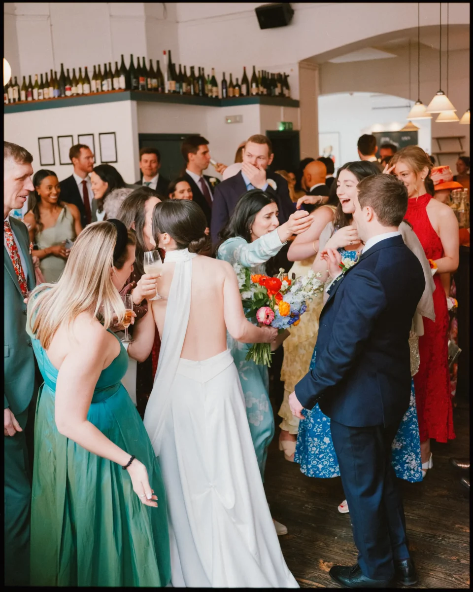 camberwell arms wedding - bride and groom greeted by guests