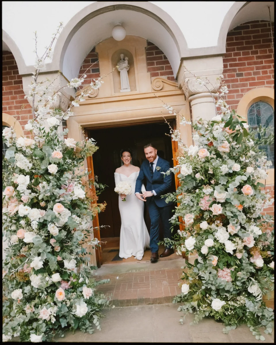 Fujifilm GFX100RF wedding photograph — bride and groom leaving church