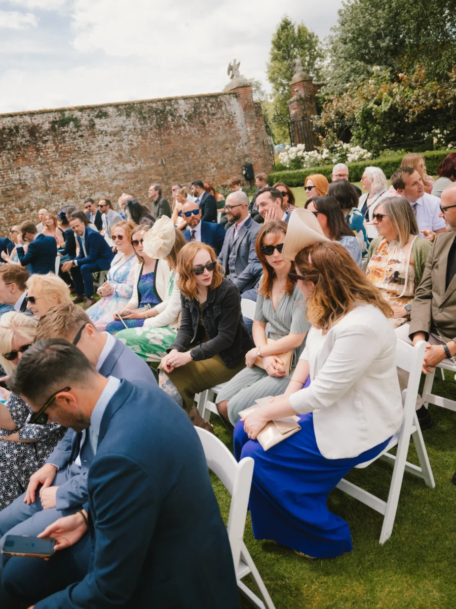 Fujifilm GFX100RF wedding photograph — guests outdoor ceremony