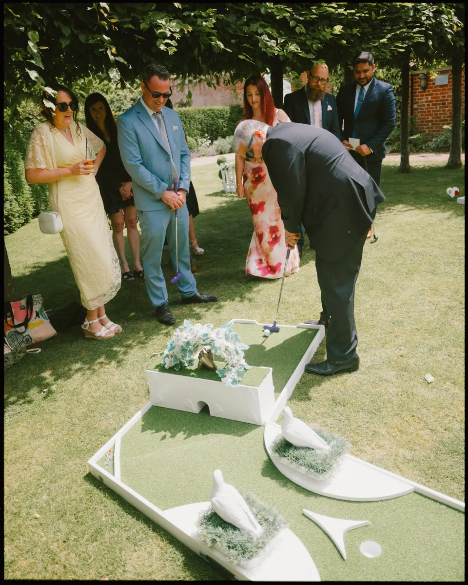 Fujifilm GFX100RF wedding photograph — mini golf cocktail hour