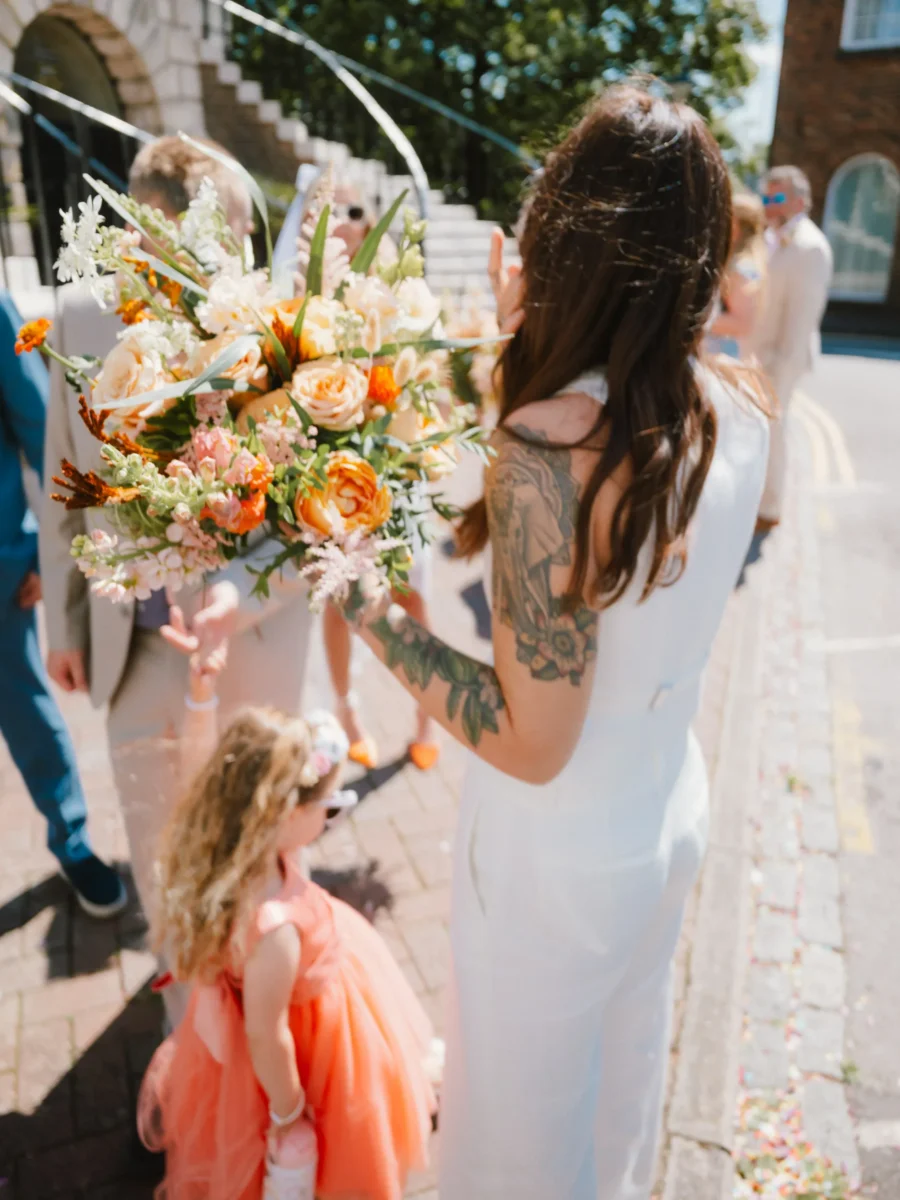 Fujifilm GFX100RF wedding photograph — tattoos and bouquet