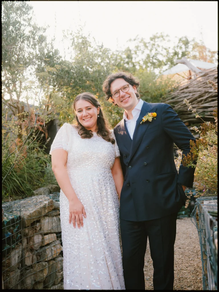 the bell in ticehurst wedding photographer - couple in the garden by the lodges and fire pit